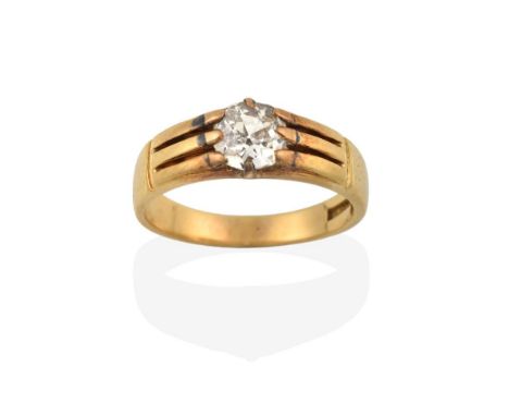 A Diamond Solitaire Ring, the old cut diamond in a yellow claw setting, to a grooved shoulder plain polished shank, estimated