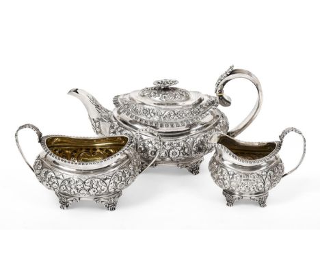 A Three-Piece George IV Silver Tea-Service, by Hyam Hyams, London 1822, each piece oval and on paw and scroll cast feet, the 