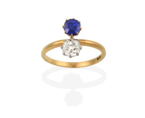 A Sapphire and Diamond Two Stone Ring, the old cut diamond in white claw settings and the cushion cut sapphire in yellow claw