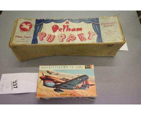 Boxed 1:72 scale Revell Curtiss P-40E Kittyhawk 1A Motorised model kit, plus a boxed Pelham puppet Mexican Boy