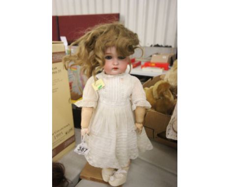 Simon & Halbig bisque headed composition doll marked K R with star to back of neck, damage to one finger, paint chips on limb