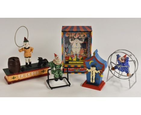 A Reuge dancing Pierrot clockwork musical stage, playing Tarara Boom De Ay;  a dancing Clown musical box;  a cast iron Trick 