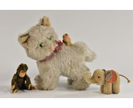 Steiff Animals- a standing grey white cat with bird riding its back, tag and button to birds leg, 21cm high;  a miniature ele