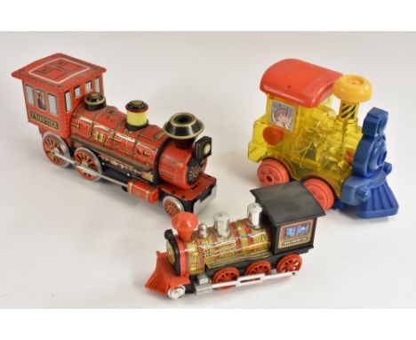 A Japanese Modern Toys Tin plate battery operated Frontier Train, red and black body, gold detailing, approx 33cm long;  othe