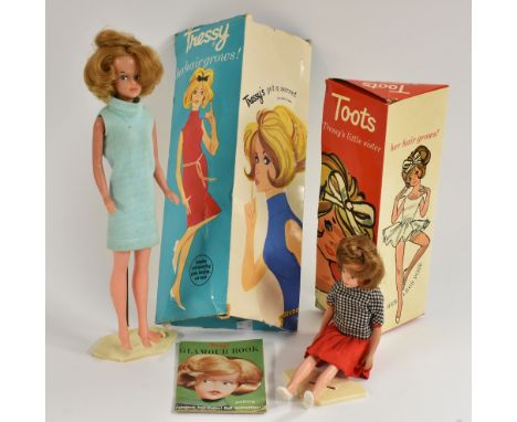 Dolls - a vintage Palitoy Tressy doll, pale blue dress; another Her Little Sister Toots, checked top, red skirt, white shoes,