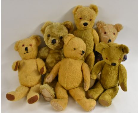 Teddy Bears - a mid 20th century long haired gold plush bear, plastic eyes, vertical nose, slight humped back body,centre sea