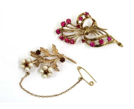 Two gold spray brooches, to include a 9ct gold garnet and pearl spray brooch, with pin and roller catch, London 1983, and a g