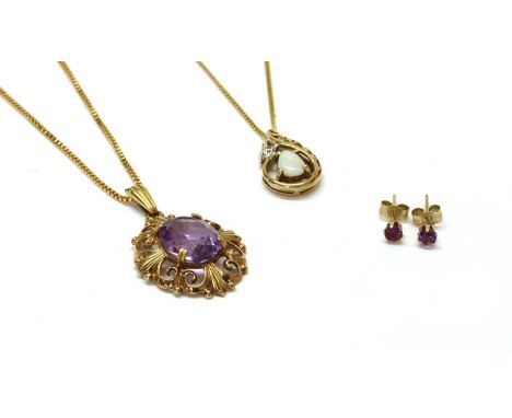 A 9ct gold single stone amethyst pendant, with an oval mixed cut amethyst, approximately 12 x 10mm, claw set to a pierced scr