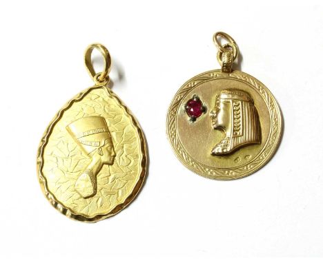A gold Nefertiti pendant, tested as approximately 18ct gold, 10.92g, together with an Austro-Hungarian pendant of a Pharoah, 