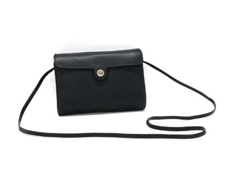 A vintage Christian Dior canvas shoulder bag,black leather fold over flap, leather edging and shoulder strap, silver-tone har