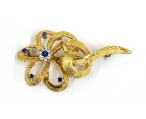 A gold synthetic sapphire and paste set spray brooch, with pin and roller catch, tested as approximately 18ct gold, 8.76gCond