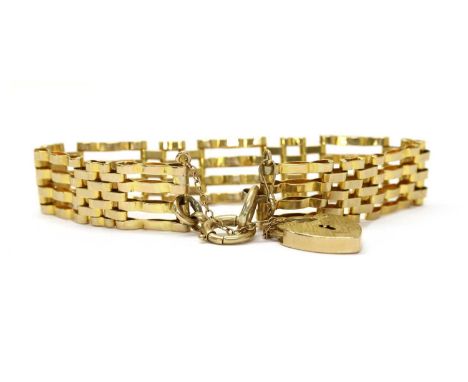 A 9ct gold gate bracelet, with crimped links, half solid bolt ring, heart shaped padlock clasp and safety chain, London, 15.4