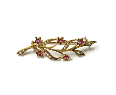 A gold ruby and split pearl spray brooch, with Swiss cut rubies grain set to floral collets, with stems grains set with split