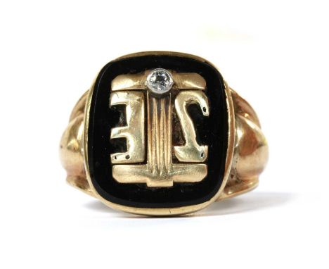 A gold onyx and diamond signet ring, with a cushion shaped plaque with applied gold initials 'JIE', and rub set with an old c