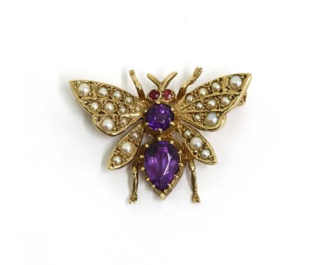 A 9ct gold amethyst, ruby and seed pearl set butterfly brooch, with pin and roller catch, London 1989, 28mm wide, 3.57gCondit