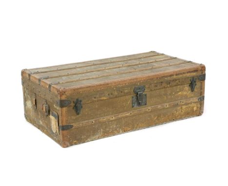A 19th century Goyard steamer trunk, the cloth bound exterior with stretched leather edges and corners, fitted metal mounts,t