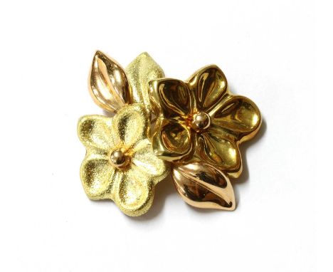 An Italian two colour gold flower brooch, the yellow gold flower heads in textured and polished finishes, with rose gold leav