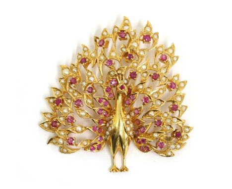 A gold ruby and split pearl peacock pendant, with concealed bale, marked 21k, tested as approximately 21ct gold, 50mm long, 2