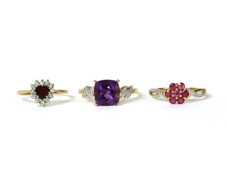 A 9ct gold amethyst ring and zircon ring, with a cushion mixed cut amethyst, approximately 9mm, claw set to shoulders grain s