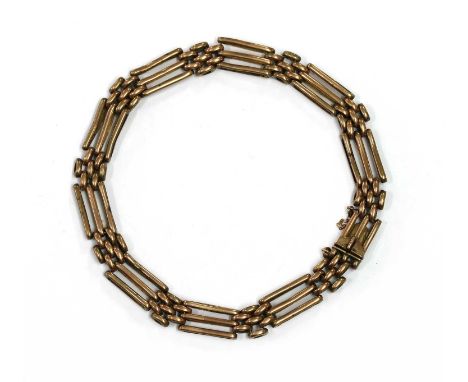 A gold gate bracelet, with box clasp, tested as approximately 9ct gold, 12.51gCondition report: Links worn, and dented.Gold v