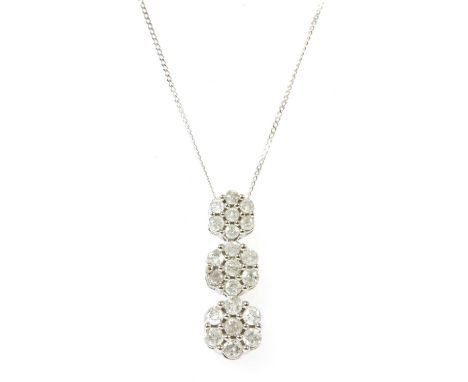 A white gold diamond cluster pendant, with three graduated daisy clusters, all claw set with seven brilliant cut diamonds, to