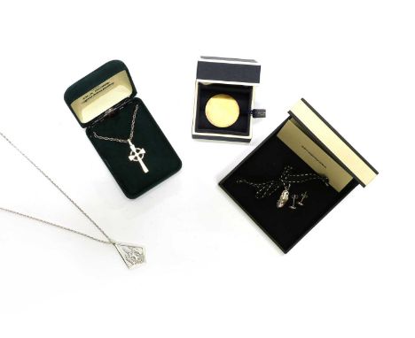 Two sterling silver pendants, by Ola Gorie, one in the form of a North Sea oil ring, the other in the form of a Celtic cross,