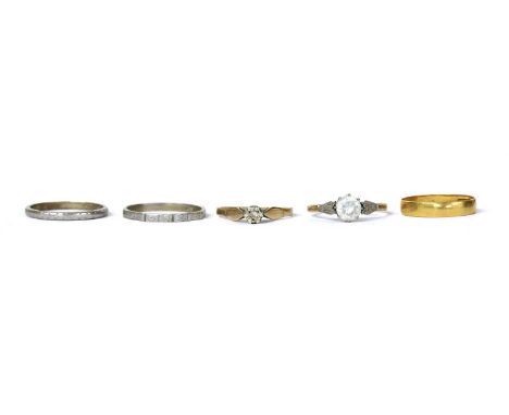 Five gold rings, to include a 22ct gold flat section wedding ring, out of shape, Birmingham, two engraved wedding rings, test