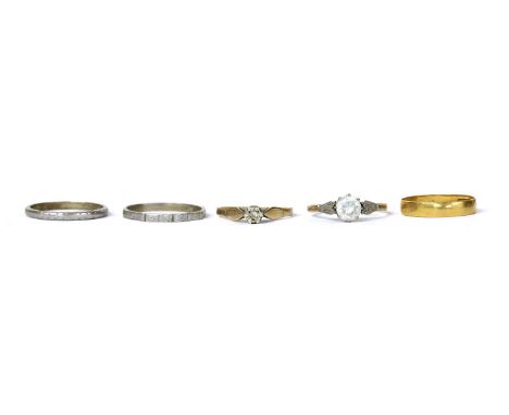 Five gold rings, to include a 22ct gold flat section wedding ring, out of shape, Birmingham, two engraved wedding rings, test