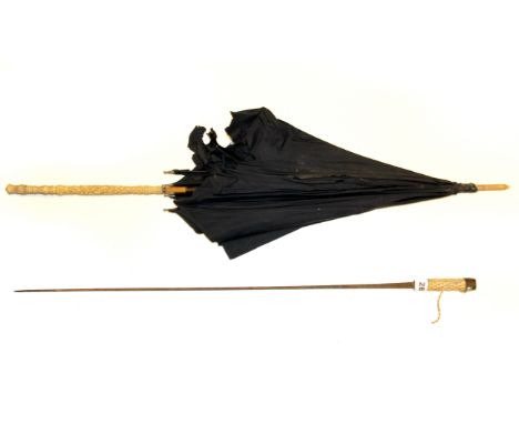 An early 20th century carved ivory handled parasol, and carved ivory handled swordstick, L. 88cm.
