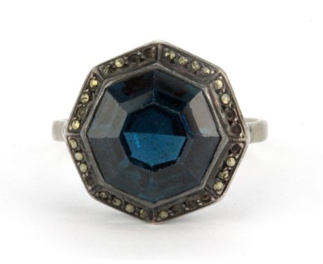 A white metal (tested silver) and marcasite stone set ring, (Q).