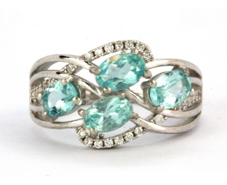 A 925 silver ring set with oval cut apatites and white stones, (N.5).