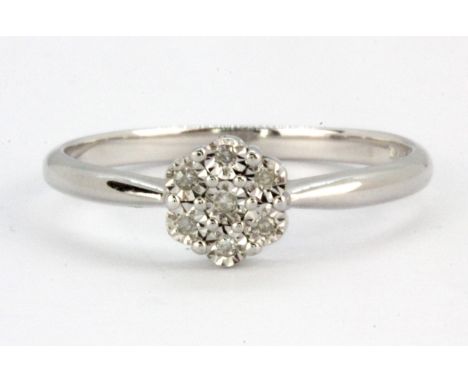 A 9ct white gold diamond set cluster ring, (L.5).