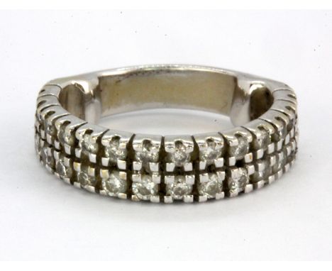 A white metal (tested high carat gold) half eternity ring set with two rows of brilliant cut diamonds, (I).