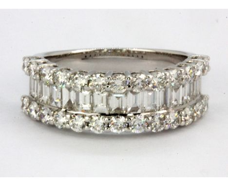 An 18ct white gold ring set with baguette and brilliant cut diamonds, approx. 2.05ct, (N.5).
