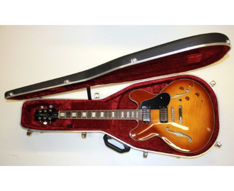 A Tanglewood honey blonde guitar in Hiscox case.