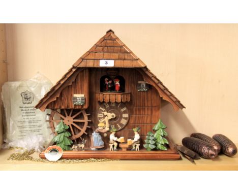 A large German cuckoo clock, H. 37cm, W. 43cm.