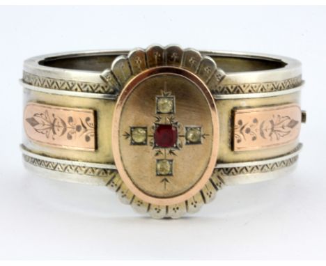 An early hallmarked silver and rose gold stone set bangle, L. 5.5cm.
