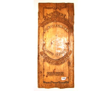 A Glen Turner scotch whisky carved wooden advertising panel, size 64 x 27cm.