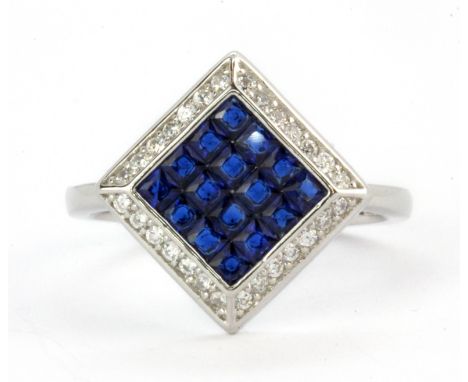 A 925 silver ring set with blue and white stones, (P), L. 1.2cm.