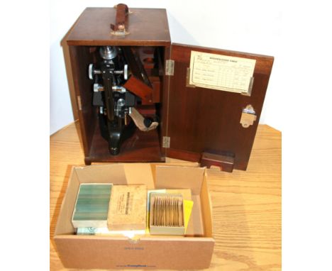 A cased Watson microscope and a box of slides.