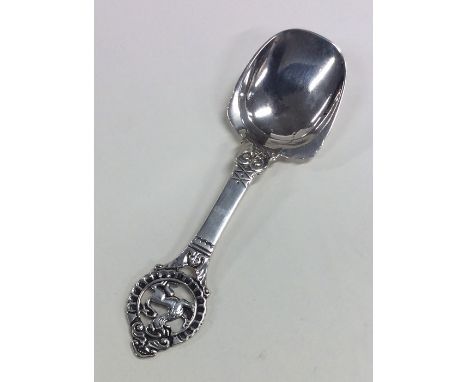 A Norwegian silver caddy spoon decorated with a dragon. Approx. 25 grams. Est. £30 - £40.