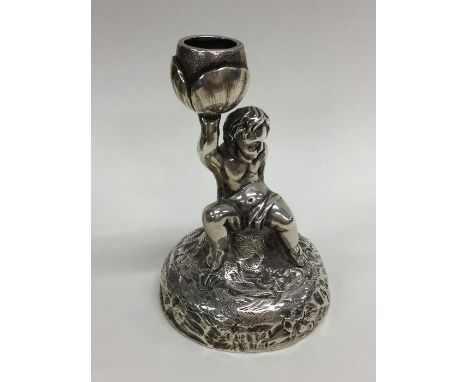 A fine and rare Victorian silver chamber stick in the form a man in seated position. London 1852. By George Fox. Approx. 81 g