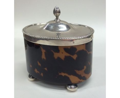 A good quality silver and tortoiseshell tea caddy with hinged lid to ball feet. Birmingham 1908. By Westwood &amp; Sons. Appr
