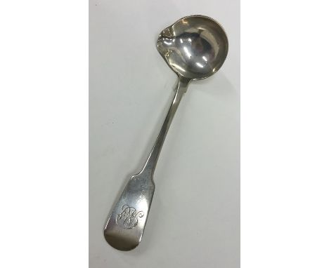 DUBLIN: An Irish silver rat tail ladle with pouring lip. By M West. Approx. 42 grams. Est. £30 - £50.