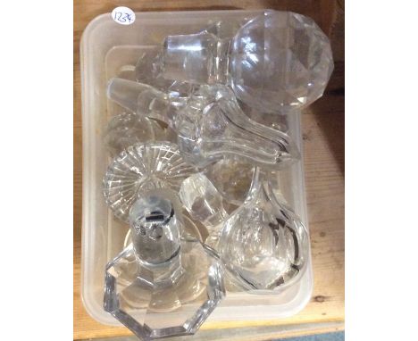 A box containing Antique cut glass decanter stoppers. Est. £15 - £20.