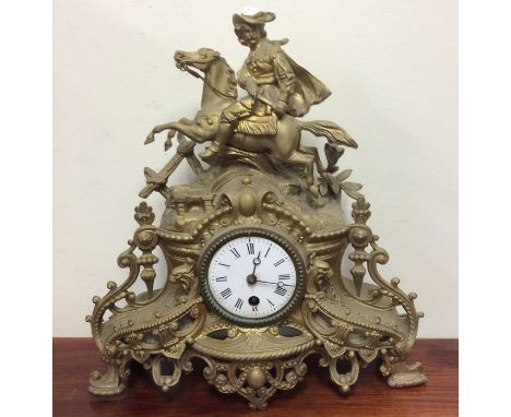 A spelter mantle clock on pedestal base. Est. £30 - £50.