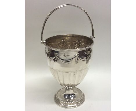 An attractive Victorian silver swing handled basket of half fluted design. London 1878. By Henry Wilkinson. Approx. 175 grams