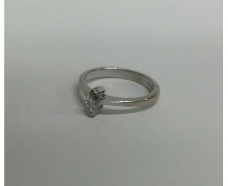 A small diamond single marquise shaped ring. Approx. 3.4 grams. Est. £150 - £200.