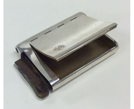 A heavy large silver hip shaped combination vesta case / snuff box. 900 Standard. Approx. 168 grams. Est. £120 - £150.