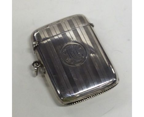 A massive engine turned silver vesta case with hinged top. Birmingham 1913. Approx. 43 grams. Est. £30 - £40.